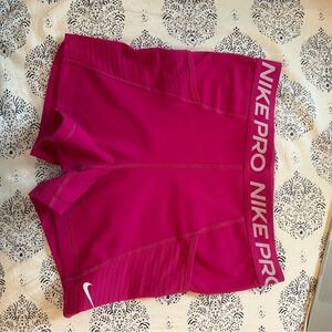 Pink Nike Pro shorts